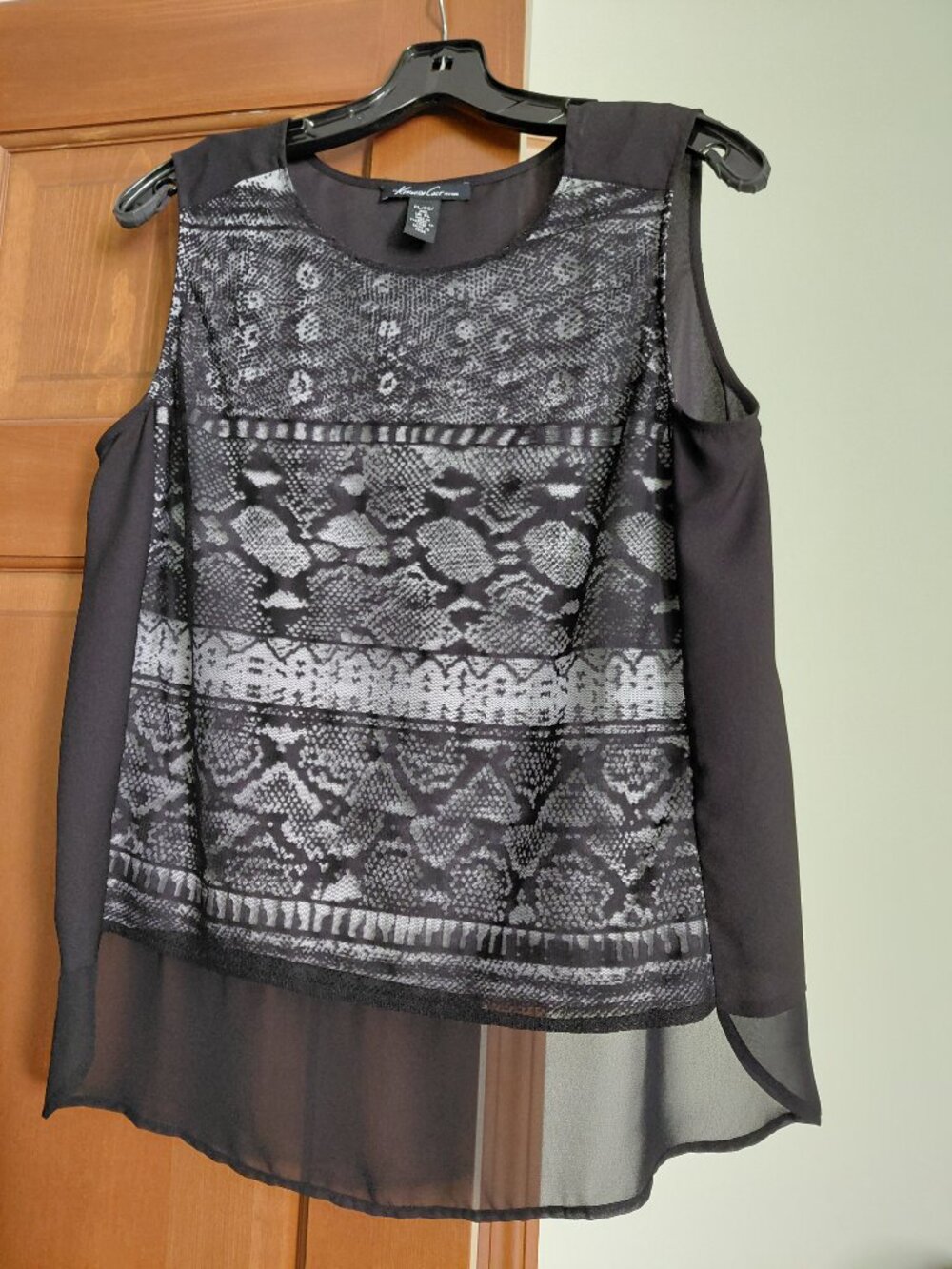 Dressy sleeveless top.  Lace front with white underlay.  Hi-low hem. Petite L
